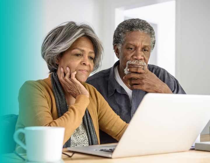 couple reading a computer screen together