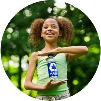 child holding a recyclable bottle